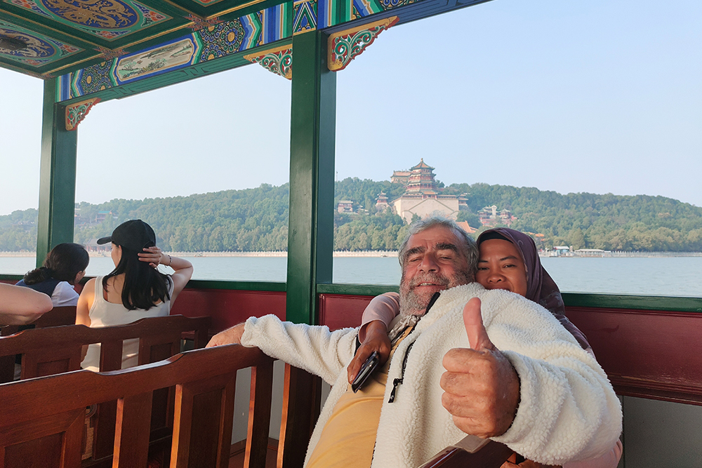 Tour 4 ,  Panda house . Summer Palace  . Olympic Center . Take a rickshaw go through hutong and visit a local family .  Yandaixiejie Hutong and Houhai lake .